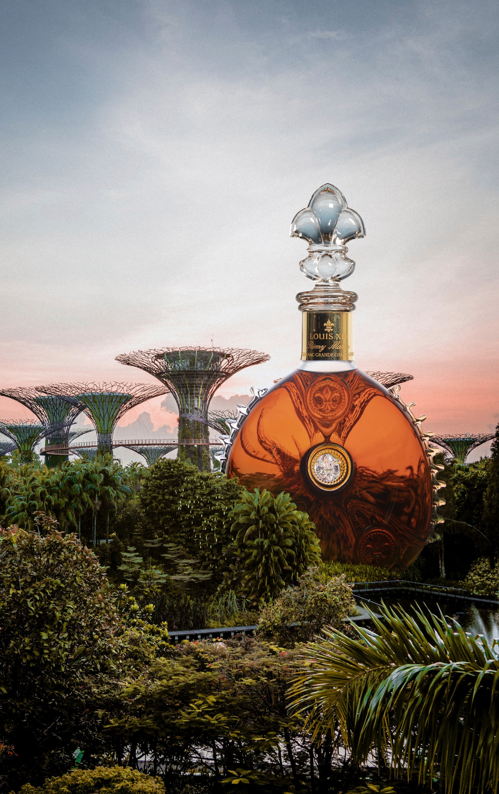 A lifestyle image of LOUIS XIII decanter featured on the background of Singaporean Gardens by the Bay