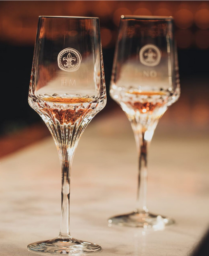 A lifestyle photo of LOUIS XIII crystal glasses on a bar countertop